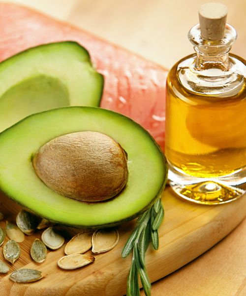 woman talking online with a bun getting perimenopause coaching online